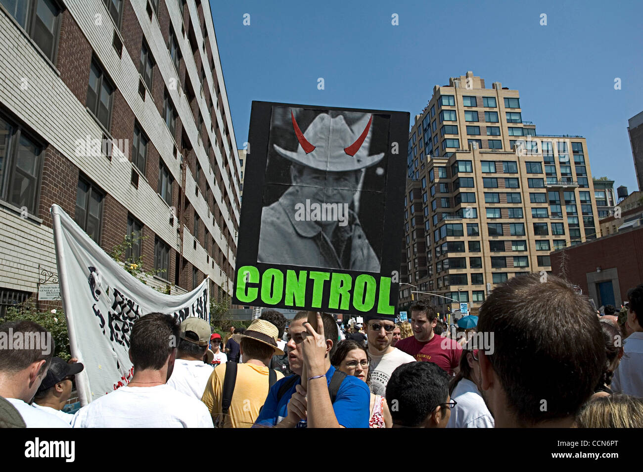 Aug 29, 2004; New York, NY, USA; Protest sign of Bush with devil horns and caption reading ''Control'', at the UPFJ march at the RNC in NYC. Stock Photo