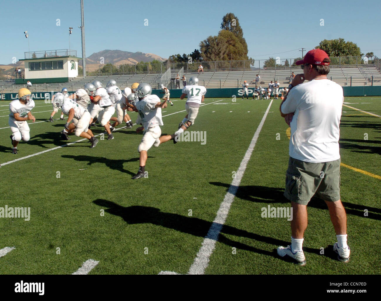 Head coach Bob Ladouceur,right, watches his offense during practice at De La Salle high school in Concord Calif., Thursday August 26,2004.  (Contra Costa Times/Bob Larson) Stock Photo