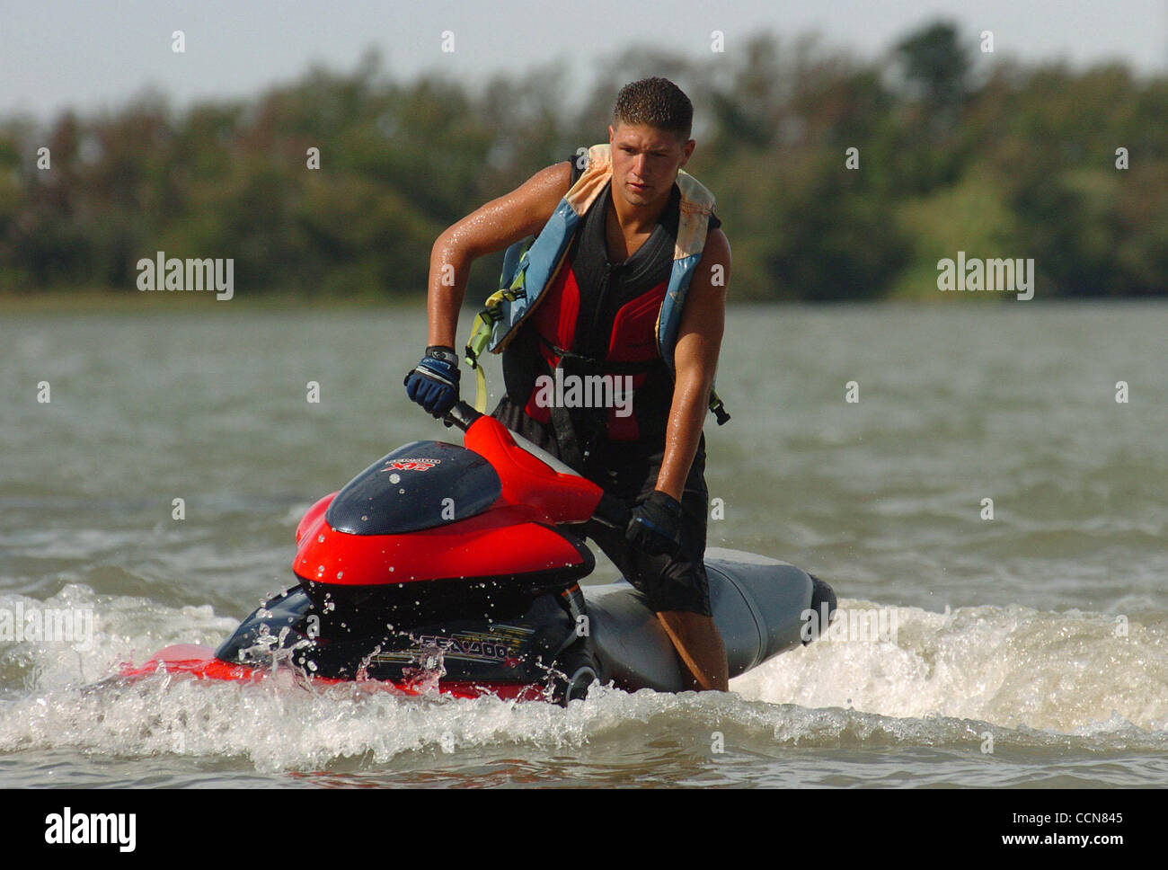 4:25 pm - A.J. Garcia, age 20, from Antioch, rides his wave runner towards the Antioch Boat Ramp while enjoying an afternoon of fun on the San Joaquin River on Thursday, August 19, 2004 in Antioch, Calif. (Jose Carlos Fajardo/Contra Costa Times) Stock Photo
