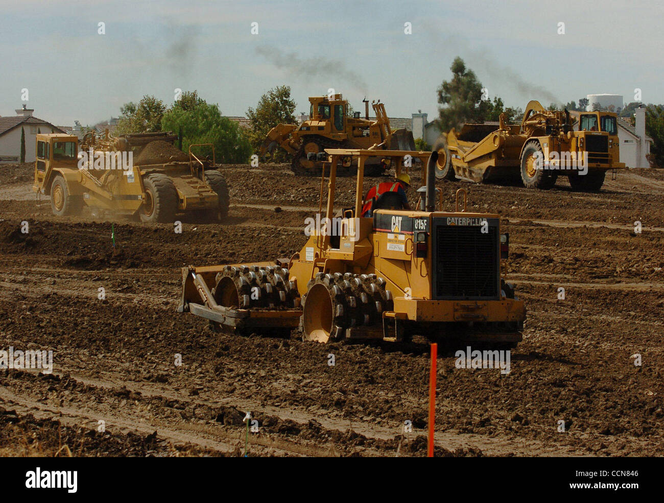 3:15 pm - Work crews work quickly to level ground for future construction at the corner of Canada Valley Road and Lone Tree Way on Thursday, August 19, 2004 in Antioch, Calif. Southeast Antioch has experienced a large housing and retail boom in the past fews years with no end in sight. (Jose Carlos  Stock Photo