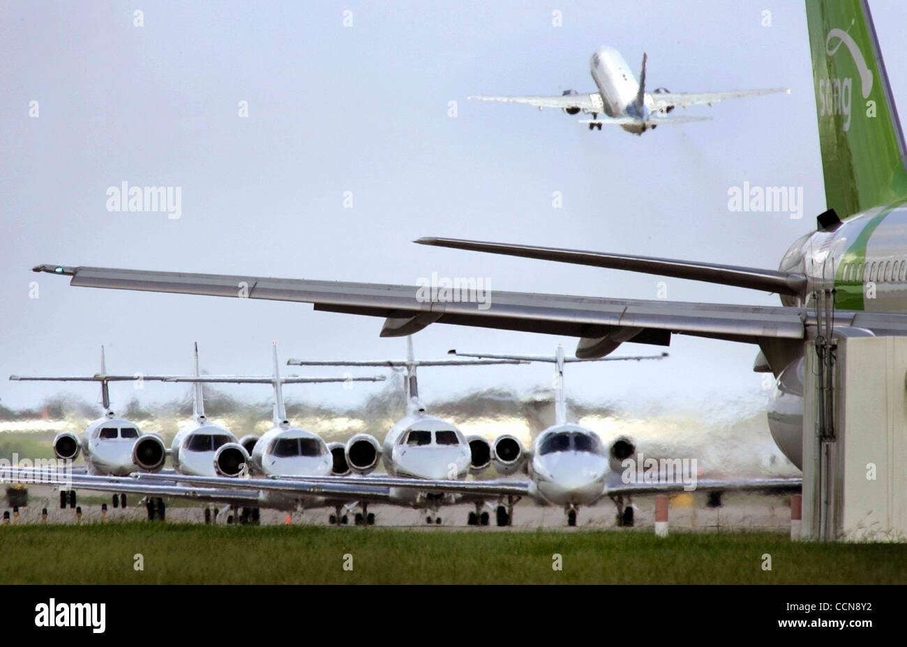 090204 West Palm Beach, FL...Private jets stackup waiting to takeoff behind a Song flight at