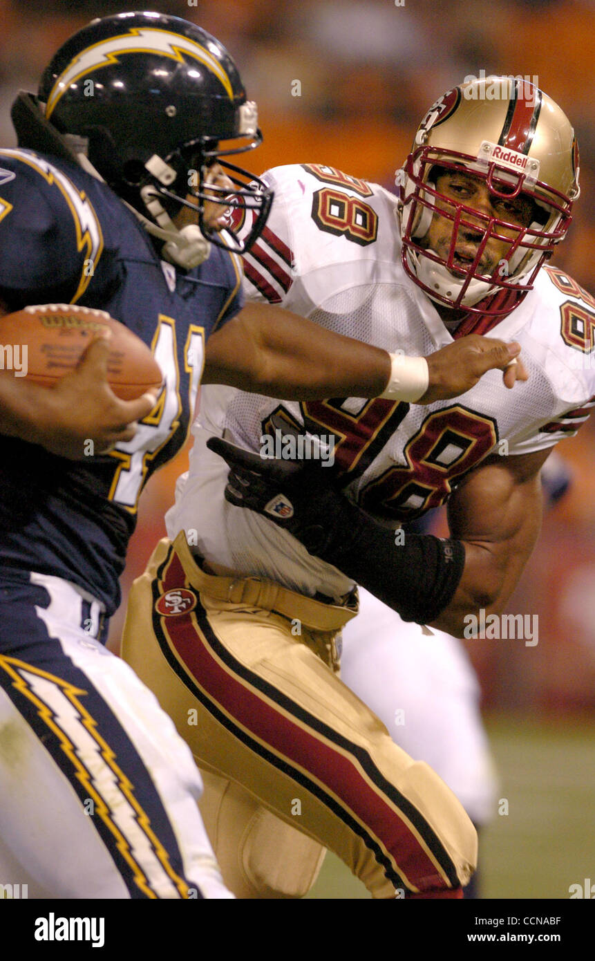 49ers LB Julian Peterson chases down Charger FB Lorenzo Neal during their game Thursday, Sept. 2, 2004, against the Chargers in San Francisco, Calif.   (Contra Costa Times/Bob Pepping) Stock Photo