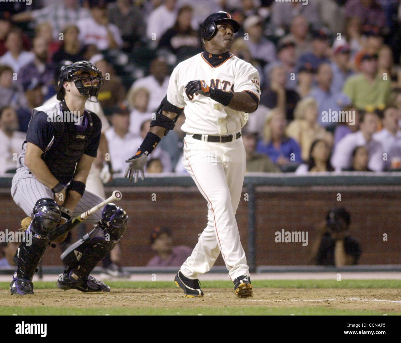 San Francisco Giants Barry Bonds makes it 697 as he watches the flight of a two run home run ball bringing home Deivi Cruz in the second inning against the Arizona Diamondbacks at SBC Park, Friday, September 3, 2004, in San Francisco, Calif. Diamondback catcher Chris Snyder also watches. (Contra Cos Stock Photo