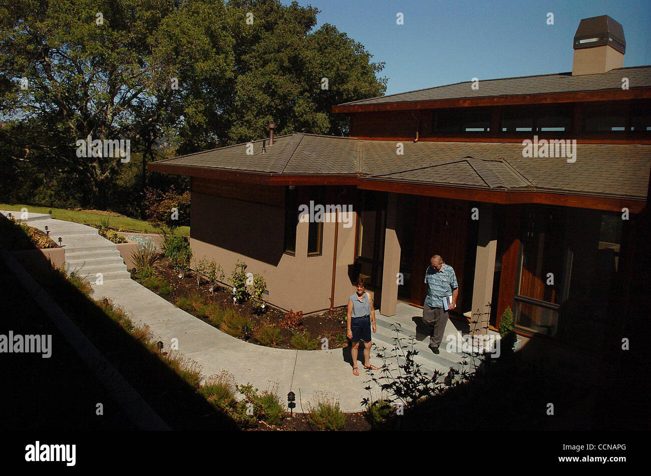 (L-R) Jodi Rice and her husband Bud Rice, from Orinda, exit after looking at a house for sale by Village Real Esate broker/owner Joan Eggers during an open house on Sunday, September 5, 2004 in Lafayette, Calif. The four bedroom home is selling for 3.25 million dollars and has been on the market for Stock Photo