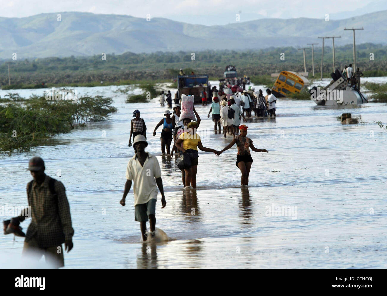 GONAIVES, HAITI; 9/21/04 Haitians leave Gonaives Tuesday evening on