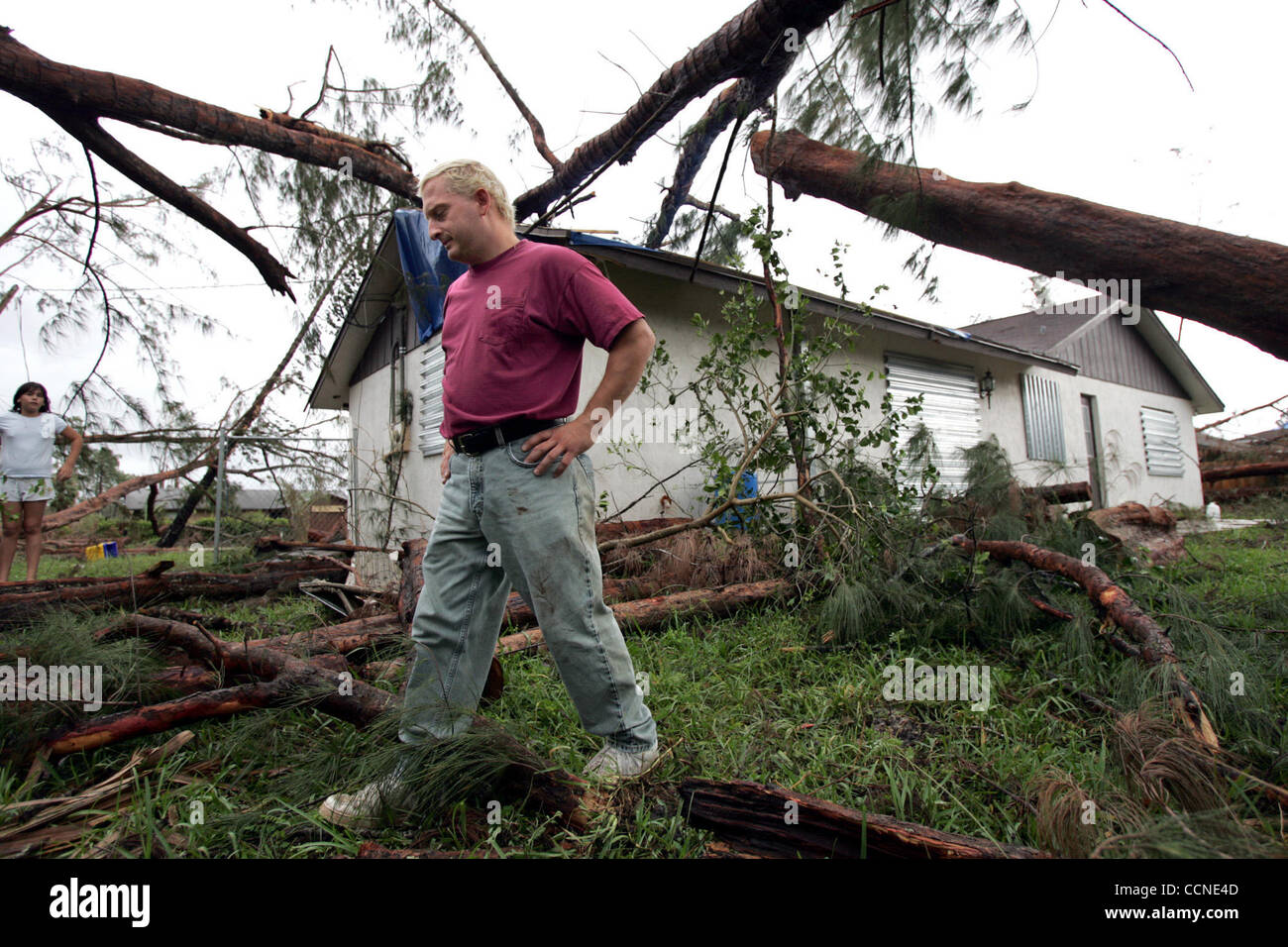 092604 hur ae--Joe Darretta of Loxahatchee Groves surveys the damage done to his home after hurricane Jeanne. Darretta's home on San Diego was also damaged by hurricane Frances. Darretta decided not to stay in his home for Jeanne and it  was a good thing as more Austrialin pine trees fell on his roo Stock Photo