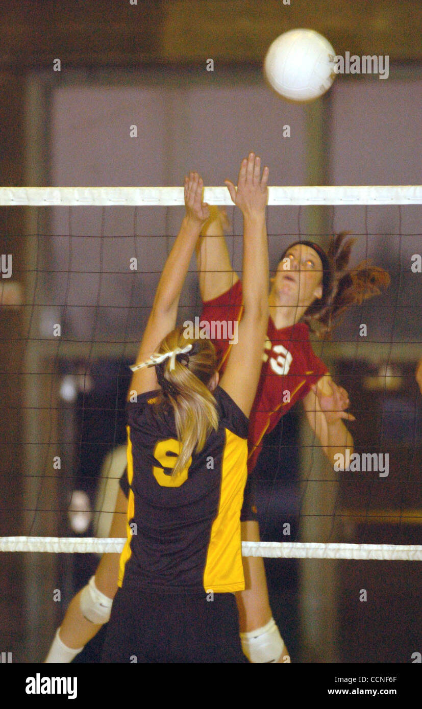 Liberty High School's Allison Cecchini spikes the ball over Antioch High School's Monica Dickerson, #9, during their game in Antioch, Calif., on Tuesday September 27,2004. (Contra Costa Times/Bob Larson) Stock Photo