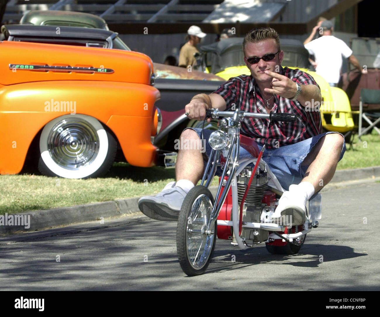 Doug Fraschiero (cq) of Martinez, Calif. rides his mini chopper during the  Billetproof Nor Cal 2004 car show at the Contra Costa County Fairgrounds in  Antioch, Calif. on Saturday, September 25, 2004.
