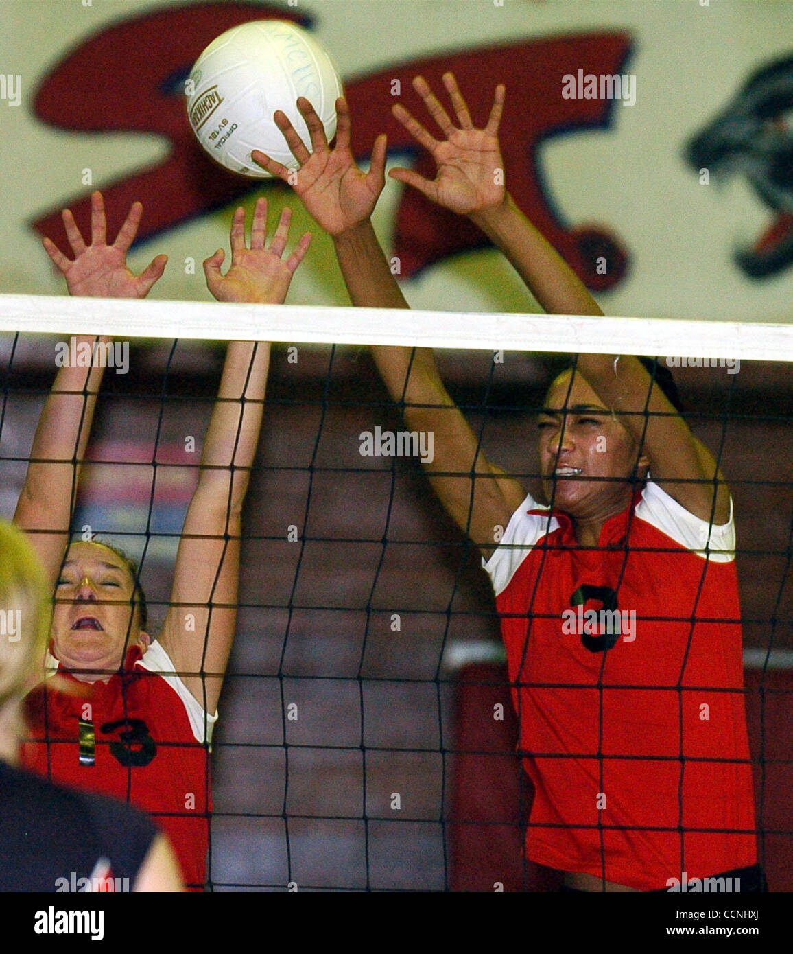 (l to r) Janie Barnes and Natalie Bogan of Saint Mary High can not stop a spike by Albany High from going over the net on Tuesday, October 19, 2004 in Berkeley, Calif. (Contra Costa Times/ Gregory Urquiaga) Stock Photo
