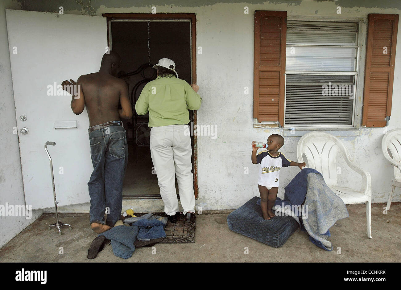 BELLE GLADE11.02.04Martha Bourne , Boston, center, with coworker and friend, Laurel