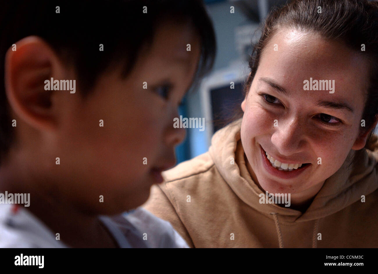 Good Samaritan Jennifer Lopez, 26, right, visits with Michael Moses