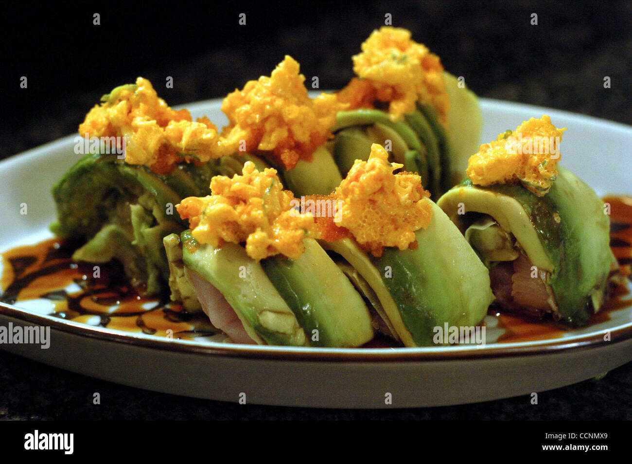 The Barry Rollcontaining hamachi, avocado, masogo, egi and unagi at