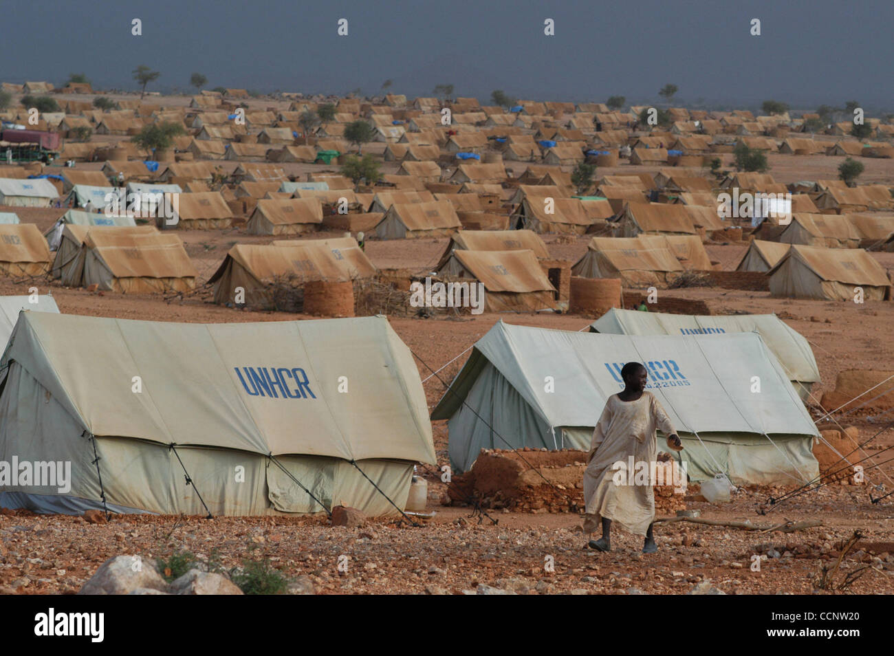 July 16, 2004, Abeche, Chad - A boy walks amid the thousands of tents provided by the United Nations High Commisioner for Refugees that make up a massive camp  for refugees from Darfur. (Credit: David Snyder/ZUMA Press) Stock Photo