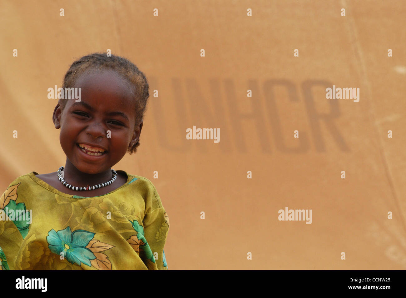 July 17, 2004, Abeche, Chad - A young girl, a refugee from Darfur, stands outside of her family tent provided by the United Nations High Commisioner for Refugees at a camp in Eastern Chad. (Credit: David Snyder/ZUMA Press) Stock Photo