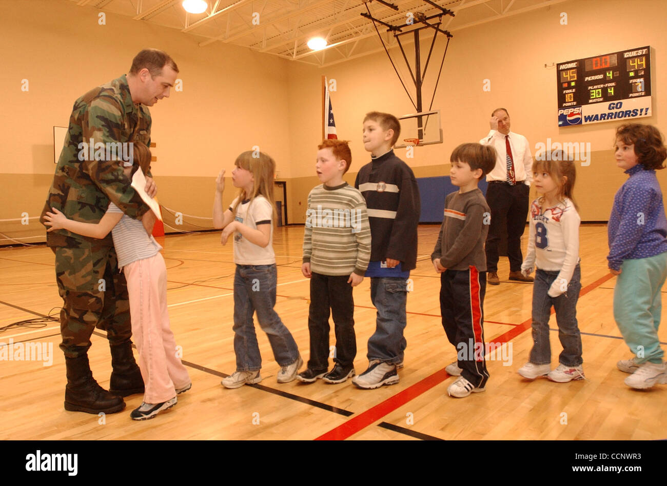 Feb 11, 2003 - Kalispell, Montana, U.S. - Asst. Principal, Goverment Teacher & Army National Guard 1st Lt. DAN ANDERSON says goodbye to his students at West Valley School near Kalispell, MT before shipping out for active duty as as part of operation Enduring Freedom & the military buildup before a p Stock Photo