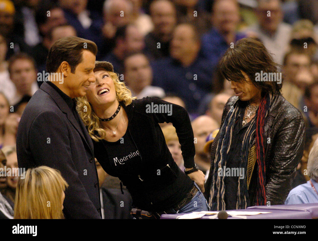 Feb 27, 2004; Los Angeles, CA, USA; Actors JOHN TRAVOLTA, UMA THURMAN and musician STEVEN TYLER of 'Aerosmith' use Staples Center, during a Los Angeles Lakers game against the Sacramento Kings, as their stage while filming the sequel to 'Get Shortie' called 'Be Cool.' This is the first time John and Stock Photo