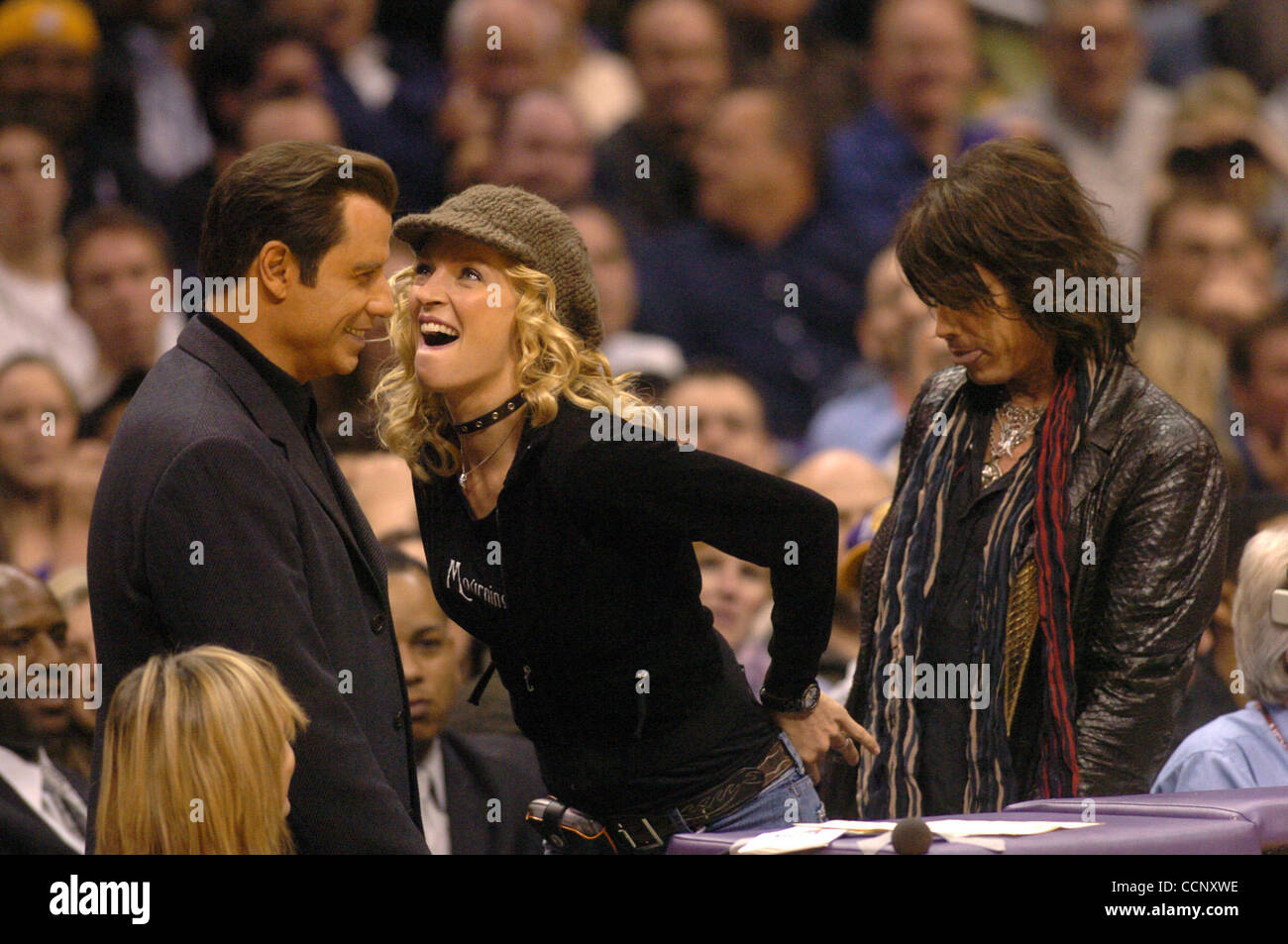 Feb 27, 2004; Los Angeles, CA, USA; Actors JOHN TRAVOLTA, UMA THURMAN and musician STEVEN TYLER of 'Aerosmith' use Staples Center, during a Los Angeles Lakers game against the Sacramento Kings, as their stage while filming the sequel to 'Get Shortie' called 'Be Cool.' This is the first time John and Stock Photo