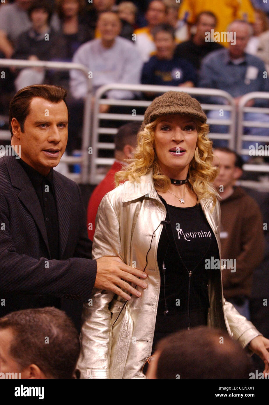 Feb 27, 2004; Los Angeles, CA, USA; Actors JOHN TRAVOLTA, UMA THURMAN and musician Steven Tyler of 'Aerosmith' use Staples Center, during a Los Angeles Lakers game against the Sacramento Kings, as their stage while filming the sequel to 'Get Shortie' called 'Be Cool.' This is the first time John and Stock Photo