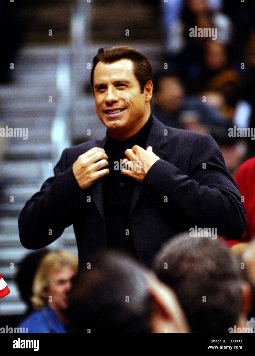 Feb 27, 2004; Los Angeles, CA, USA; Actors JOHN TRAVOLTA, Uma Thurman and musician Steven Tyler of 'Aerosmith' use Staples Center, during a Los Angeles Lakers game against the Sacramento Kings, as their stage while filming the sequel to 'Get Shortie' called 'Be Cool.' This is the first time John and Stock Photo