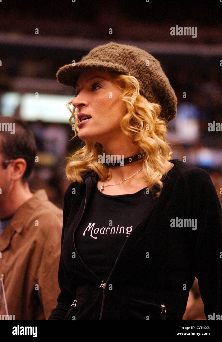 Feb 27, 2004; Los Angeles, CA, USA; Actors John Travolta, UMA THURMAN and musician Steven Tyler of 'Aerosmith' use Staples Center, during a Los Angeles Lakers game against the Sacramento Kings, as their stage while filming the sequel to 'Get Shortie' called 'Be Cool.' This is the first time John and Stock Photo