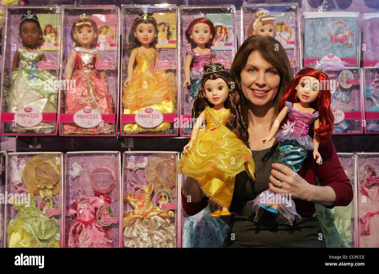 Jennifer Caveza, VP of marketing for Jakks Pacific, with a new line of  dolls made by her company called Disney Princess & Me. (Photo by Ringo Chiu  / Zuma Press Stock Photo -