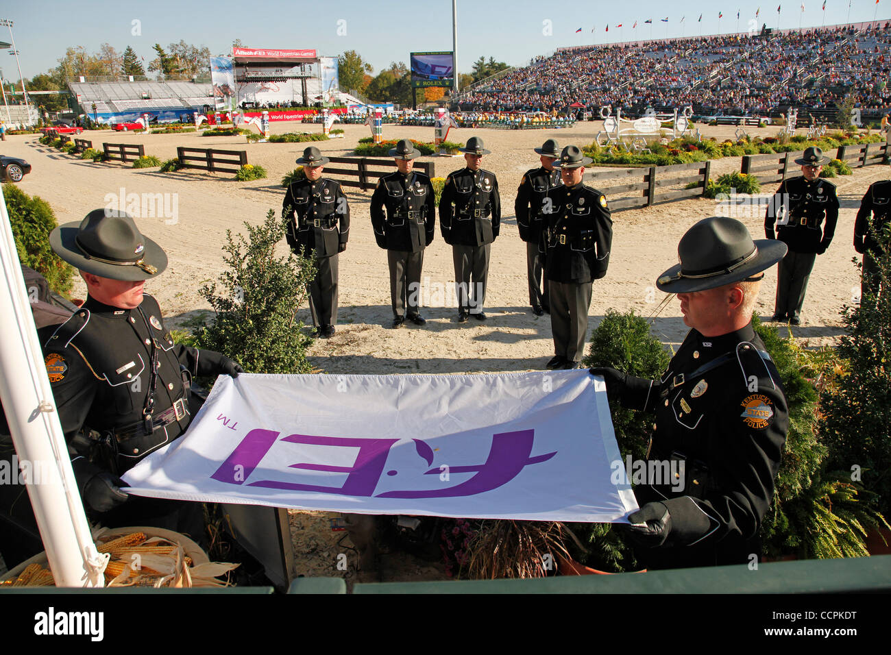 Members of the Kentucky State Police lowered and folded the FEI flag