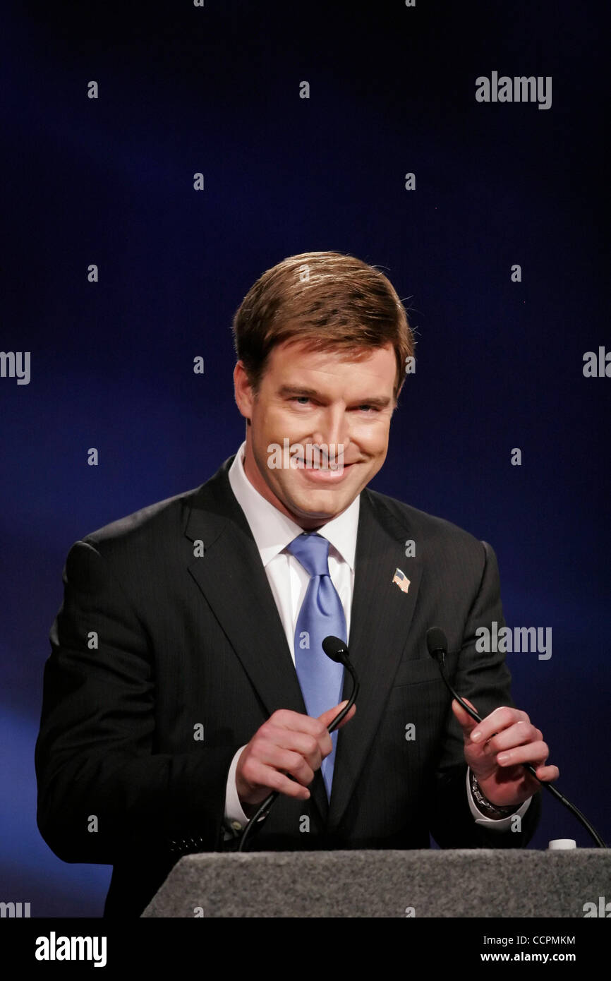 Democratic Senate nominee JACK CONWAY adjusts his microphones before