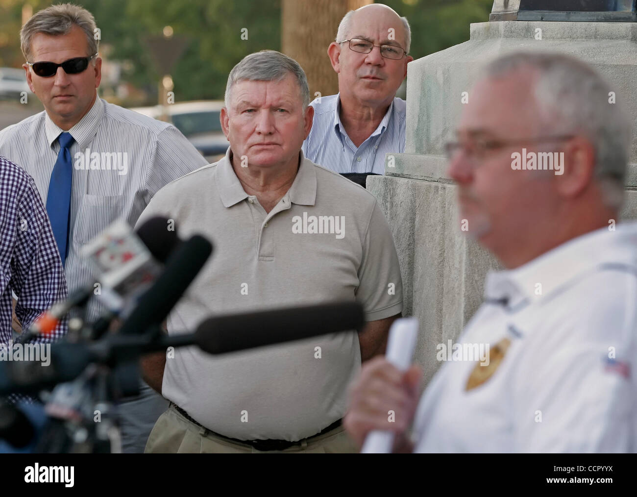 Obion County Mayor BENNY MCGUIRE (center) grimaced as Hornbeak