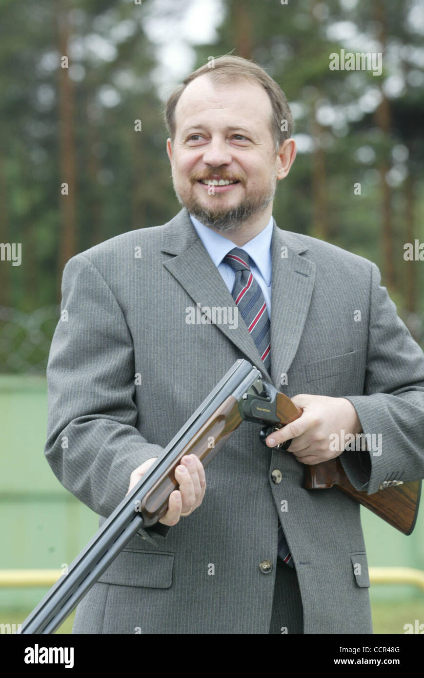Billionaire Vladimir Lisin has been named the richest man in Russia with a net worth of $15.8bn, according to by the Forbes magazine. The businessman owes his wealth to the Novolipetsk steel mill.  Pictured: Vladimir Lisin pictured with a rifle while visiting `Fox Borrow` Sport Facility near Moscow Stock Photo