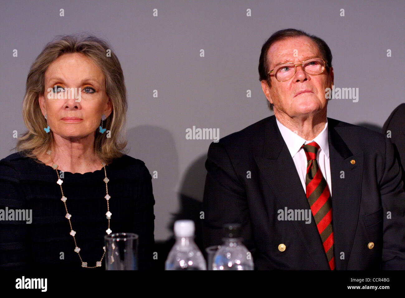 Famous British actor Sir Roger Moore, who is well known for the portrayal of the legendary secret agent James Bond, has visited Russia. As the honorary ambassador of the United Nations Childrenís Fund - UNICEF, Sir Roger Moore (pictured with his wife Kristina Tholstrup ) took part in the opening of  Stock Photo