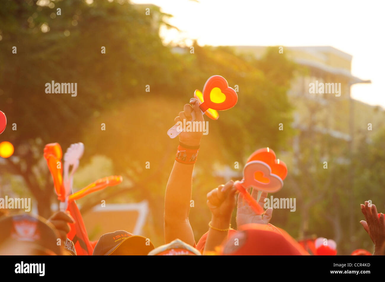 Red Shirts shake clappers as CHAVALIT YONGCHAIYUDH waves at them