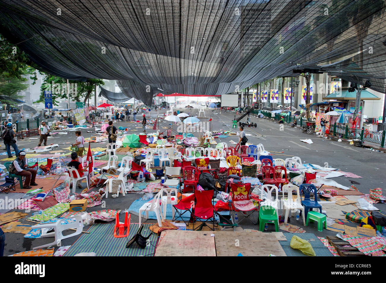 Chairs left by Red Shirts protesters after Thai government crack down on Red Shirts. Red Shirts leaders have now surrendered and told thousands of Red Shirts protesters to end their months-long protest after Thai army assault on their fortified camp. Stock Photo