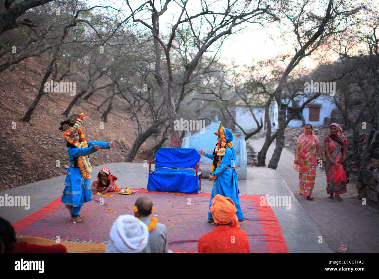 Two devotees pass by as Children dressed as Radha Krishna enact at Play ...