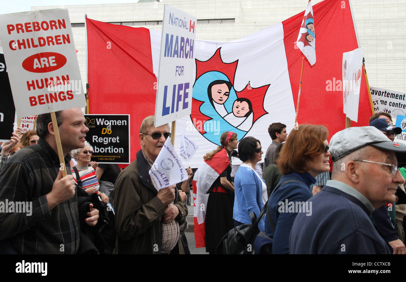 May 13, 2010 - Ottawa, Ontario, Canada - Thousands of pro-lifers march down Elgin St. during the National March for Life. Thousands of activists rallied on Parliament Hill calling for an end to abortion, urging them to reopen the bitter debate on the issue. The throng included hundreds of students d Stock Photo