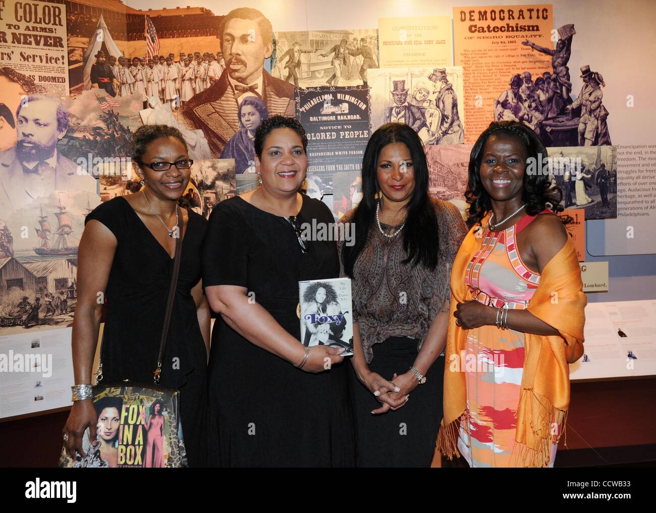 May 06, 2010 - Philadelphia, Pennsylvania, U.S. -Publicist LINDA DUGGINS, President and CEO of the AAMP ROMONA RISCOE BENSON, and Actress PAM GRIER known for her roles as 'Foxy Brown' and 'Jackie Brown' arrives at the African American Museum for a book signing of her new memoir, 'Foxy: My Life in Th Stock Photo