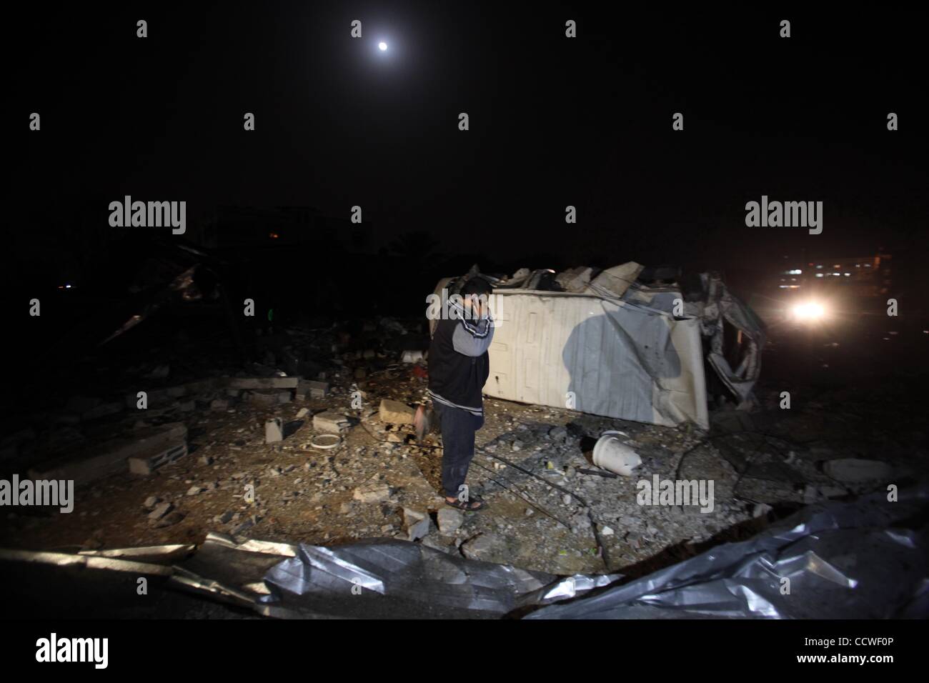 Apr 02, 2010 - Gaza City, Gaza Strip - Palestinians inspect the site of a factory destroyed after an Israeli airstrike. Israeli planes and helicopters carried out at least seven missile attacks on the Hamas-ruled Gaza Strip on Friday, causing damage and slightly wounding two children, Palestinian wi Stock Photo