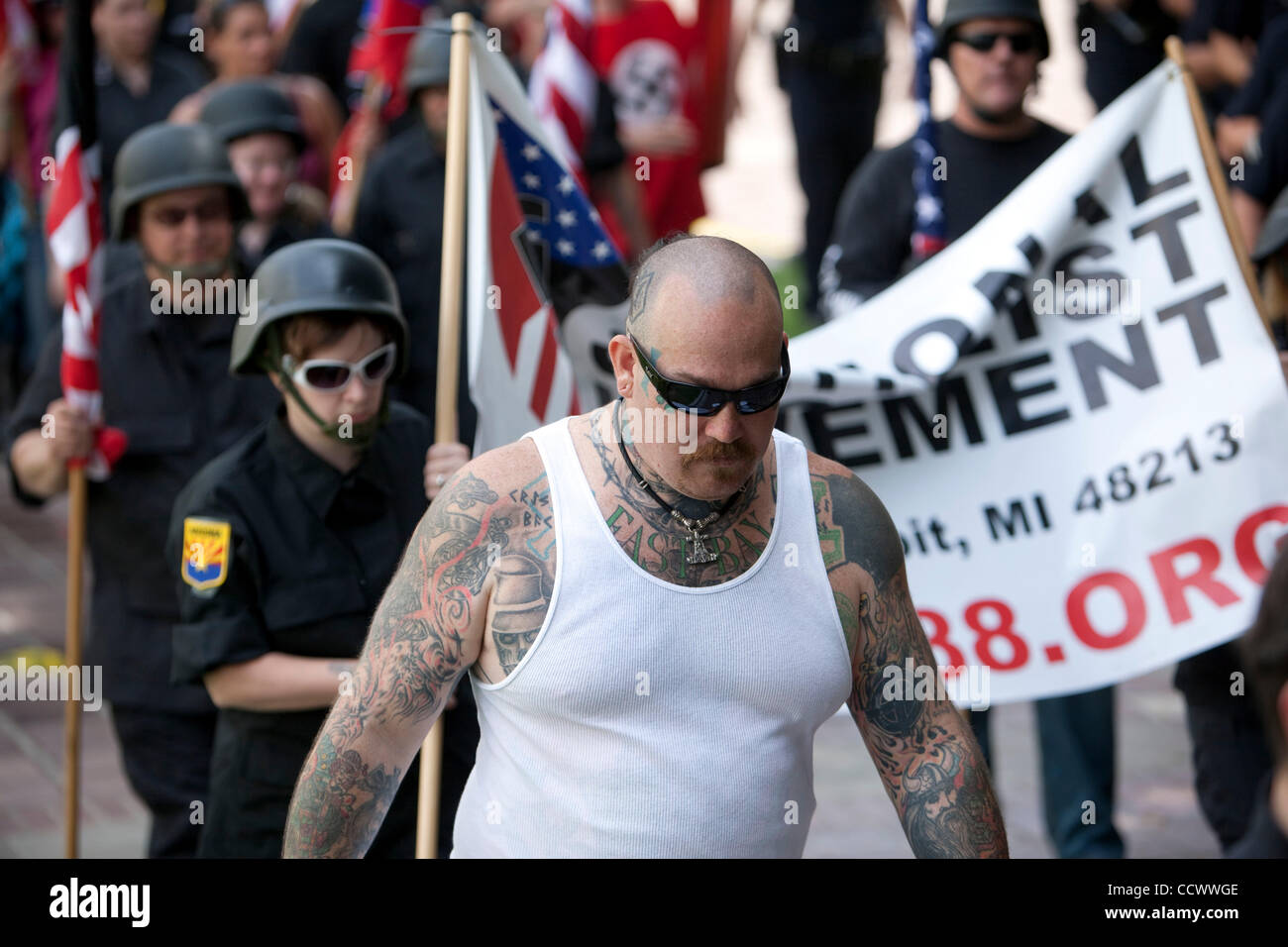 Behind heavy police protection, members of a neo nazi group spoke out against non-whites and homosexuals. Stock Photo