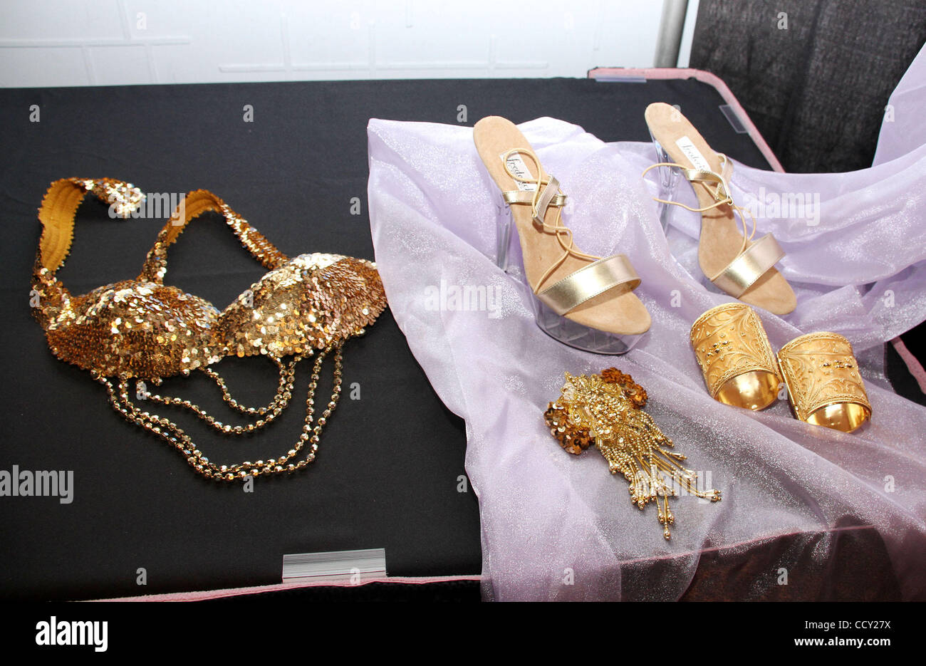 https://c8.alamy.com/comp/CCY27X/a-view-of-a-gold-sequenced-beaded-bra-fredericks-of-hollywood-heels-CCY27X.jpg