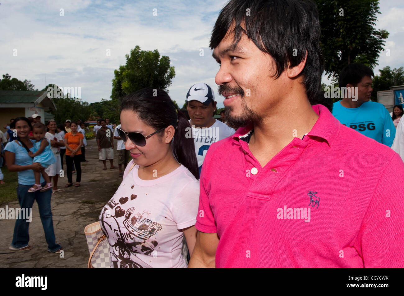 May 09, 2010 - Kiamba, Sarangani, Philippines - Boxing champion Manny Pacquiao accompanied by his wife Jinkee Jamora greet supporters as they exit polling station during the Philippine national and local elections on 10 May 2010 in Kiamba, Sarangani Philippines..Manny Pacquiao is running for the con Stock Photo