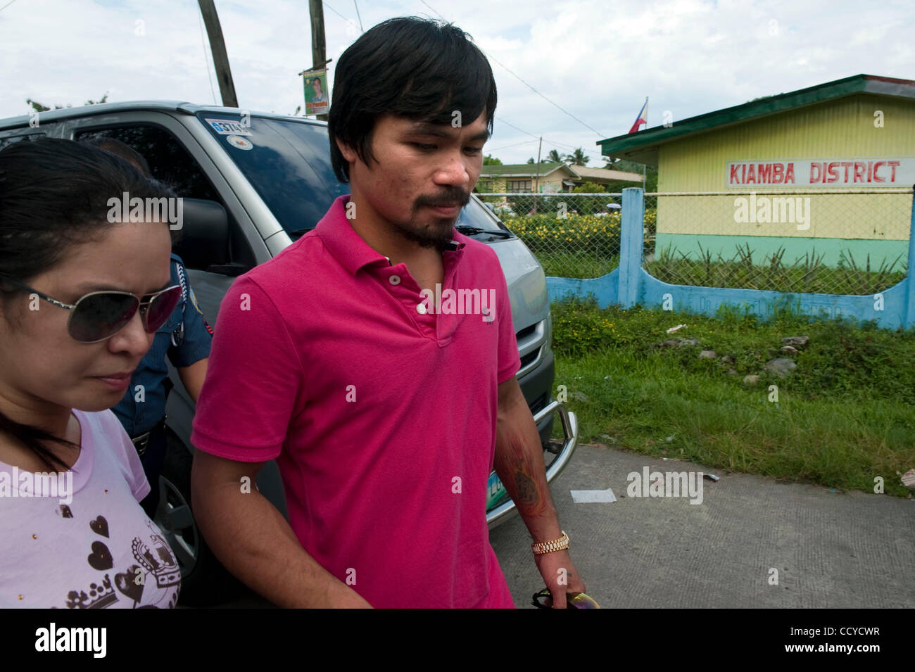 May 09, 2010 - Kiamba, Sarangani, Philippines - Boxing champion Manny Pacquiao accompanied by his wife Jinkee Jamora exit polling station during the Philippine national and local elections on 10 May 2010 in Kiamba, Sarangani Philippines..Manny Pacquiao is running for the congressman..For the first t Stock Photo