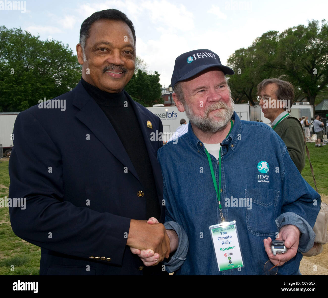 The Rev. Jesse Jackson shakes hands with President of the International Fund for Animal  Welfare, Fred O'Regan back stage at the 40th Earth Day Anniversary  celebration culminates with a free concert on the Mall in Washington, DC, April 25, 2010. Speakers included members of Congress, and activists  Stock Photo