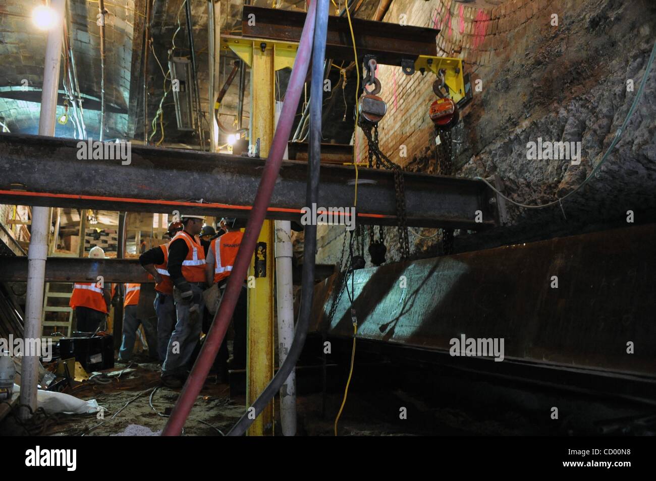 Apr 16, 2010 - Manhattan, New York, USA - Construction of an escalator shaft beneath the building at 8 John Street as the Metropolitan Transportation Authority (MTA) continues construction on the Fulton Street Transit Center, improving connections to six Lower Manhattan subway stations near the Worl Stock Photo