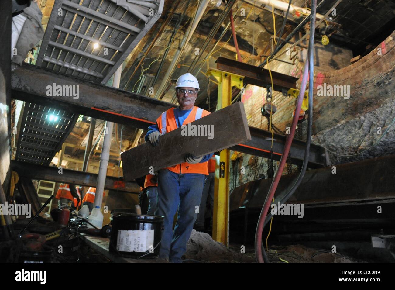 Apr 16, 2010 - Manhattan, New York, USA - Construction of an escalator shaft beneath the building at 8 John Street as the Metropolitan Transportation Authority (MTA) continues construction on the Fulton Street Transit Center, improving connections to six Lower Manhattan subway stations near the Worl Stock Photo