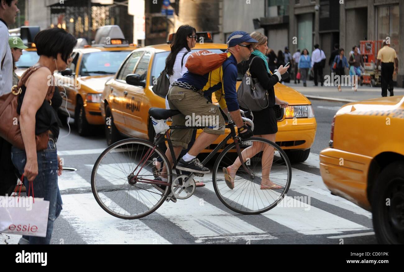May 21, 2010 - Manhattan, New York, USA - A bike messenger moves through traffic as Transportation Alternatives and Commissioners celebrate National Bike To Work Day in Times Square.  (Credit Image: Â© Bryan Smith/ZUMA Press) RESTRICTIONS:  * New York City Newspapers Rights OUT * Stock Photo