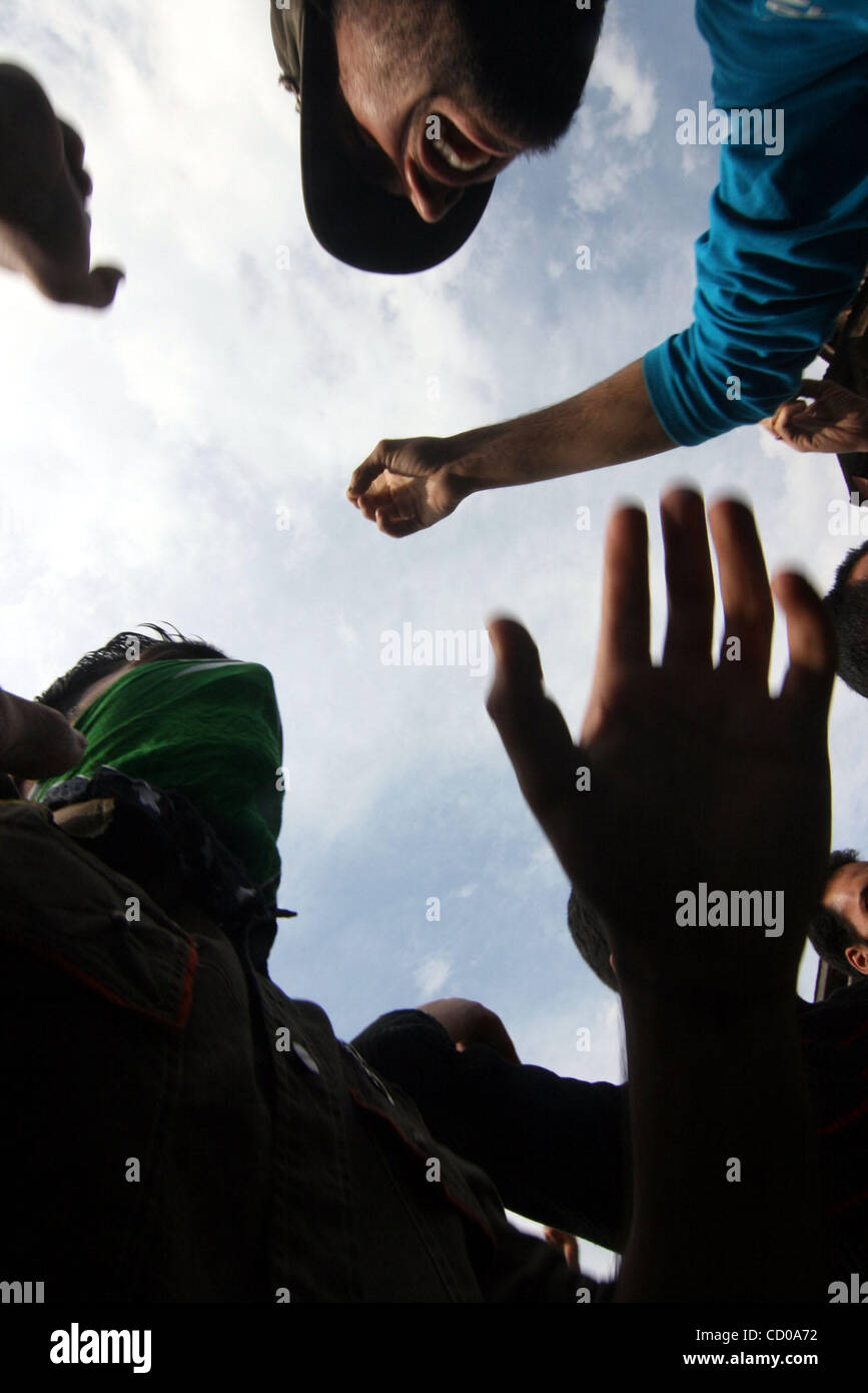 Kashmiri protesters shout slogans during a procession led Mirwaiz Umar ...