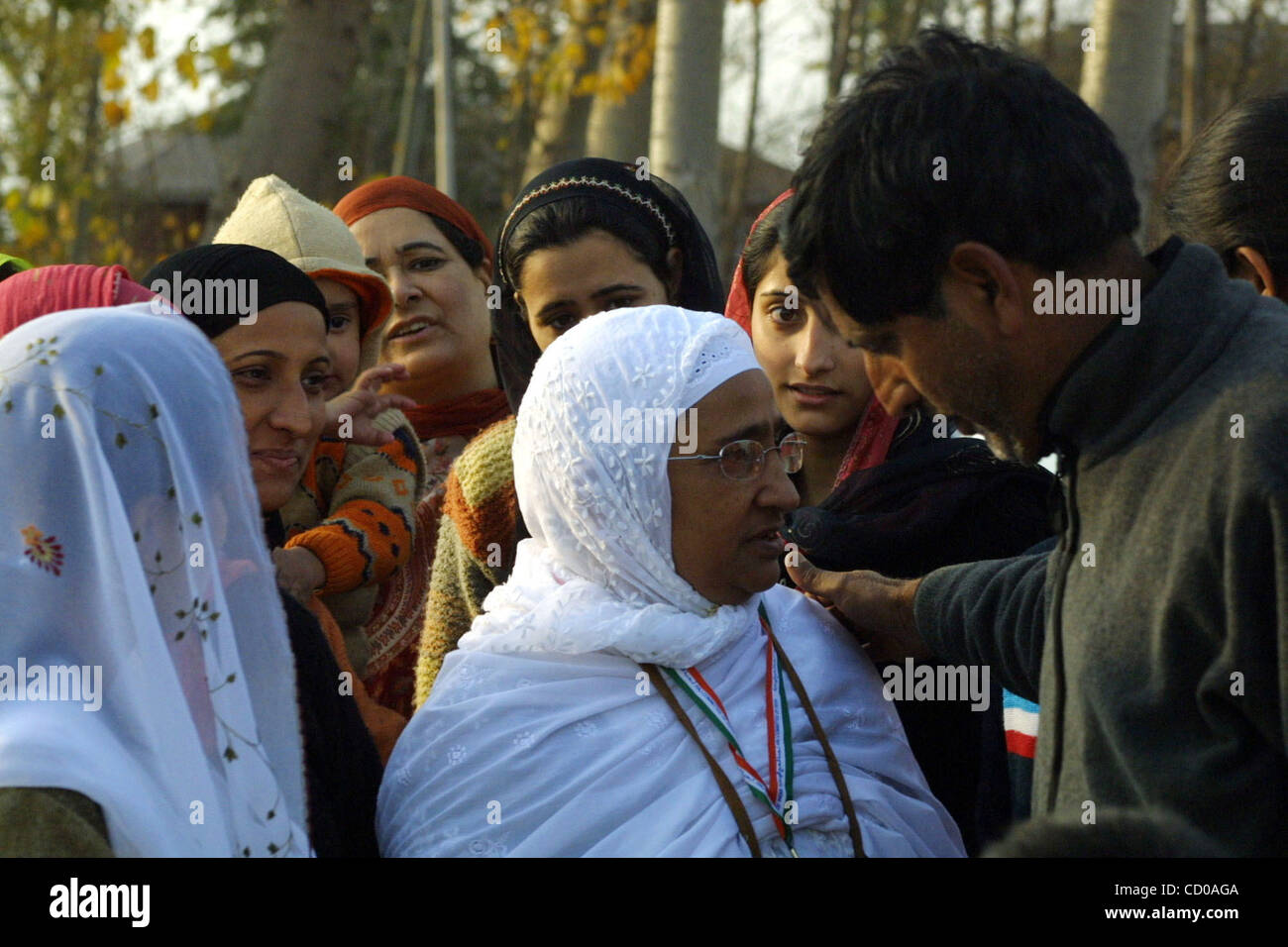 A Kashmiri Muslim woman , greets a relative in Srinagar, the summer ...