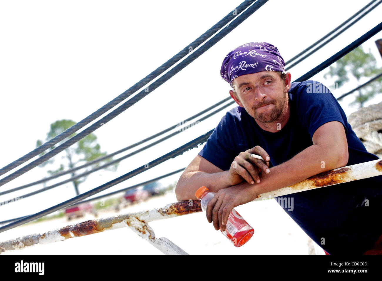 Fisherman Michael Roberson hangs out on the fishing vessel 'Aubreigh Marie' during a press conference in Bayou La Batre, Alabama USA on May 9,  2010.  The press conference was held by Deepwater Horizon Unified Incident Command to display the Vessels of Opportunity program, meant to employ local fish Stock Photo