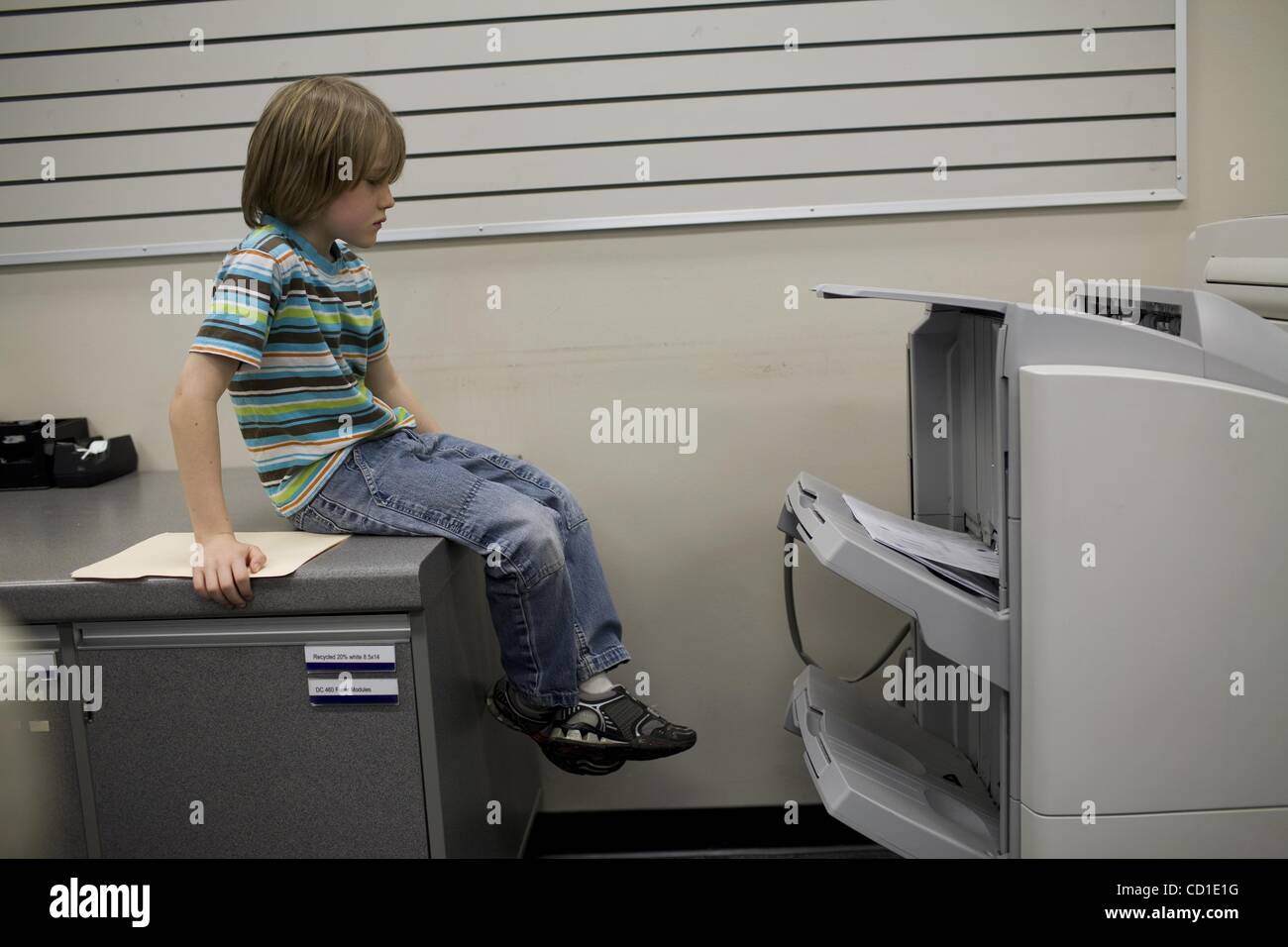 Mar 01, 2008 - Davis, California, USA - Finn O'Toole Boire waits for 45  copies of the 18th edition of his weekly newspaper, 'The Weekly Block', to  print. He then distributes them