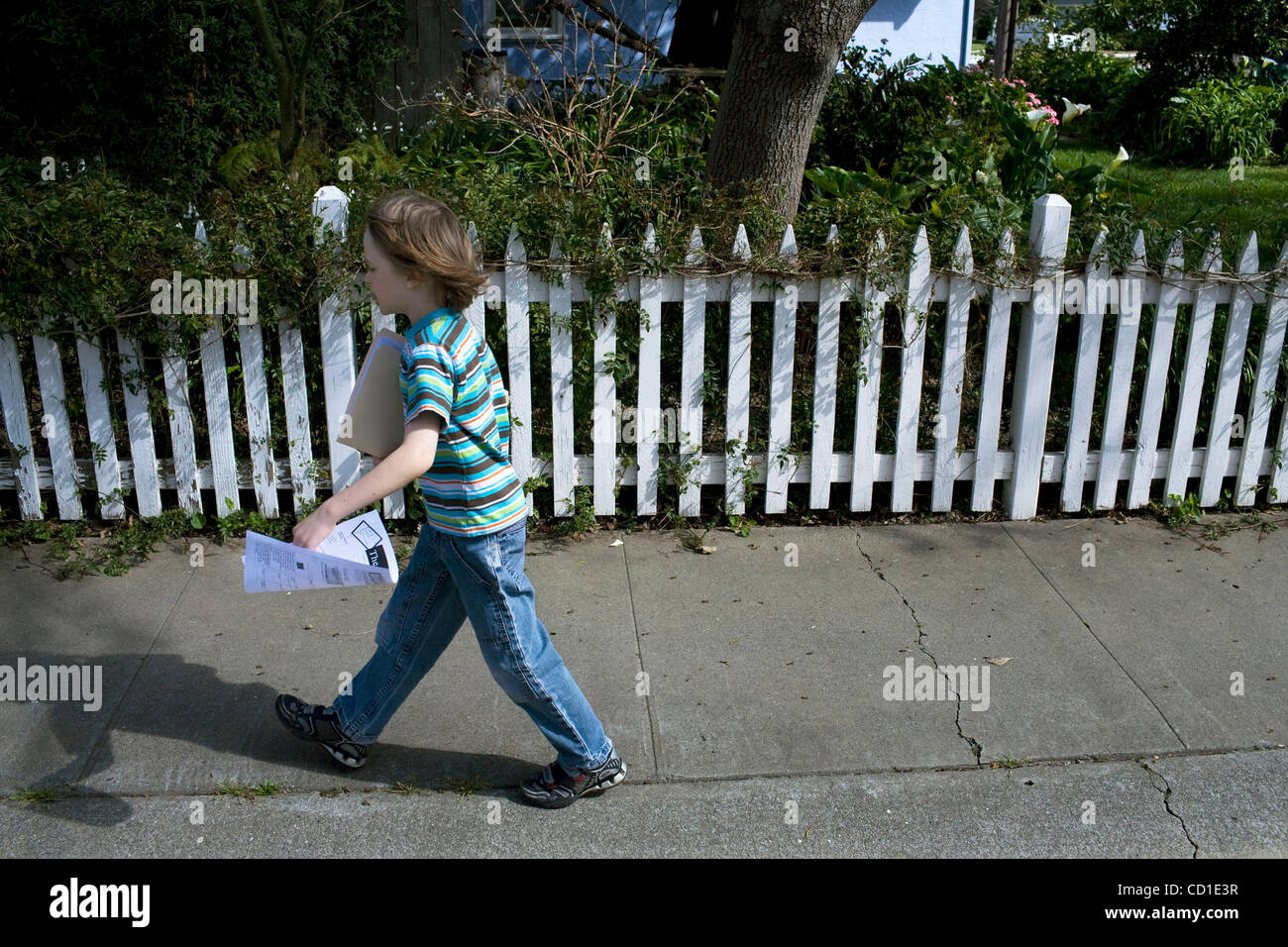 Finn O'Toole Boire, 7, delivers the 18th edition of his weekly newsletter,  The Weekly Block, in his Davis neighborhood. He hope to write 52 editions.  March 1, 2008 / The Sacramento Bee /