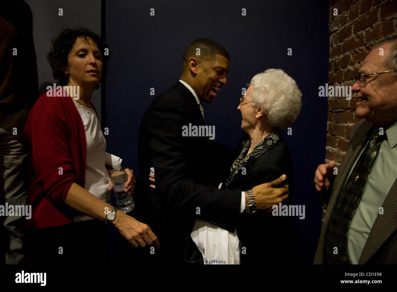Frances Collings (cq), wife of former Raley's CEO Charles Collings, embraces Kevin Johnson, who announced his candidacy for the position of Sacramento Mayor at the Guild Theater in Oak Park on Wednesday afternoon. Photography by Jose Luis Villegas, jvillegas@sacbee.com March 05, 2008 Stock Photo